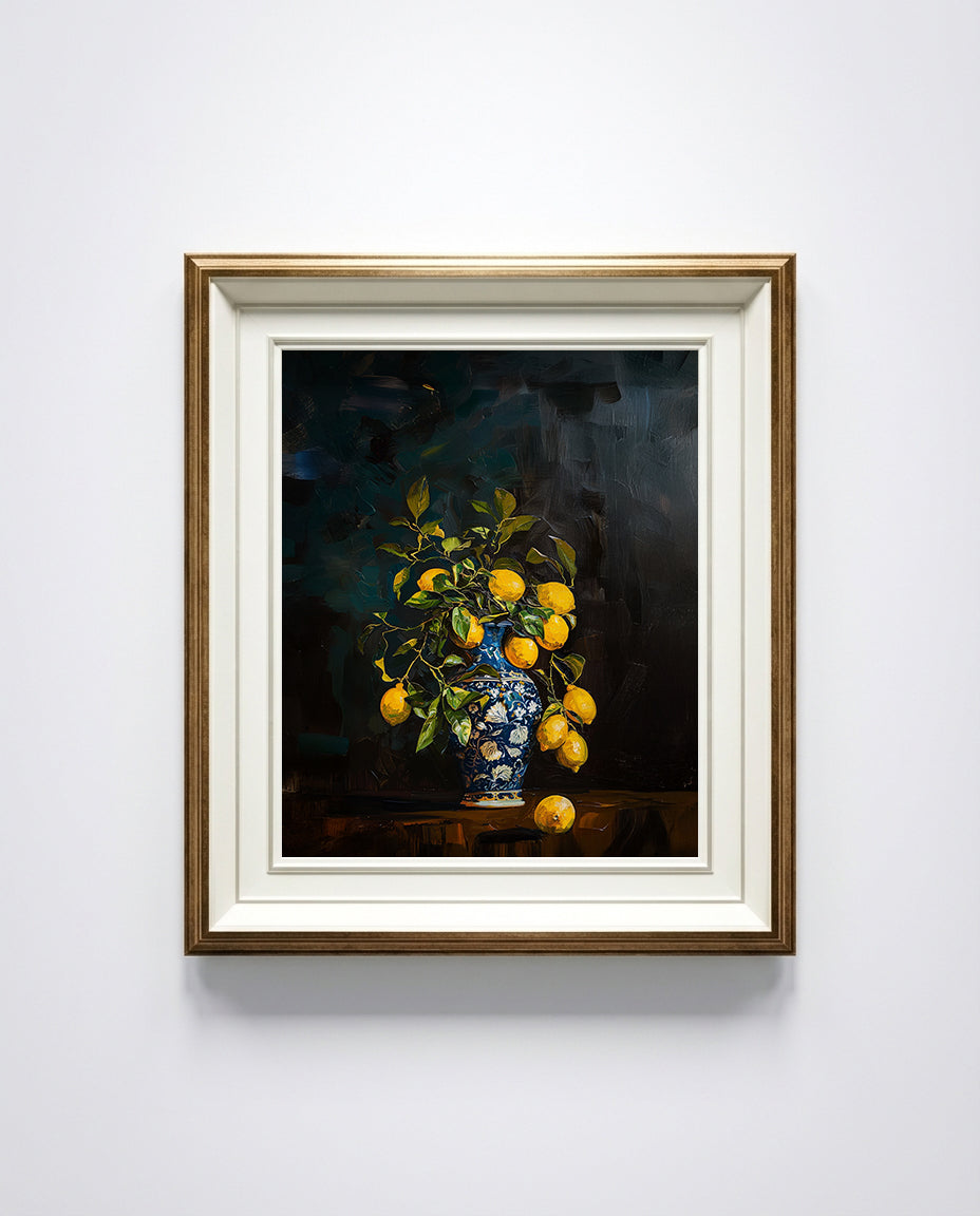 Framed artwork of a still life with lemons and a vase on a white wall.