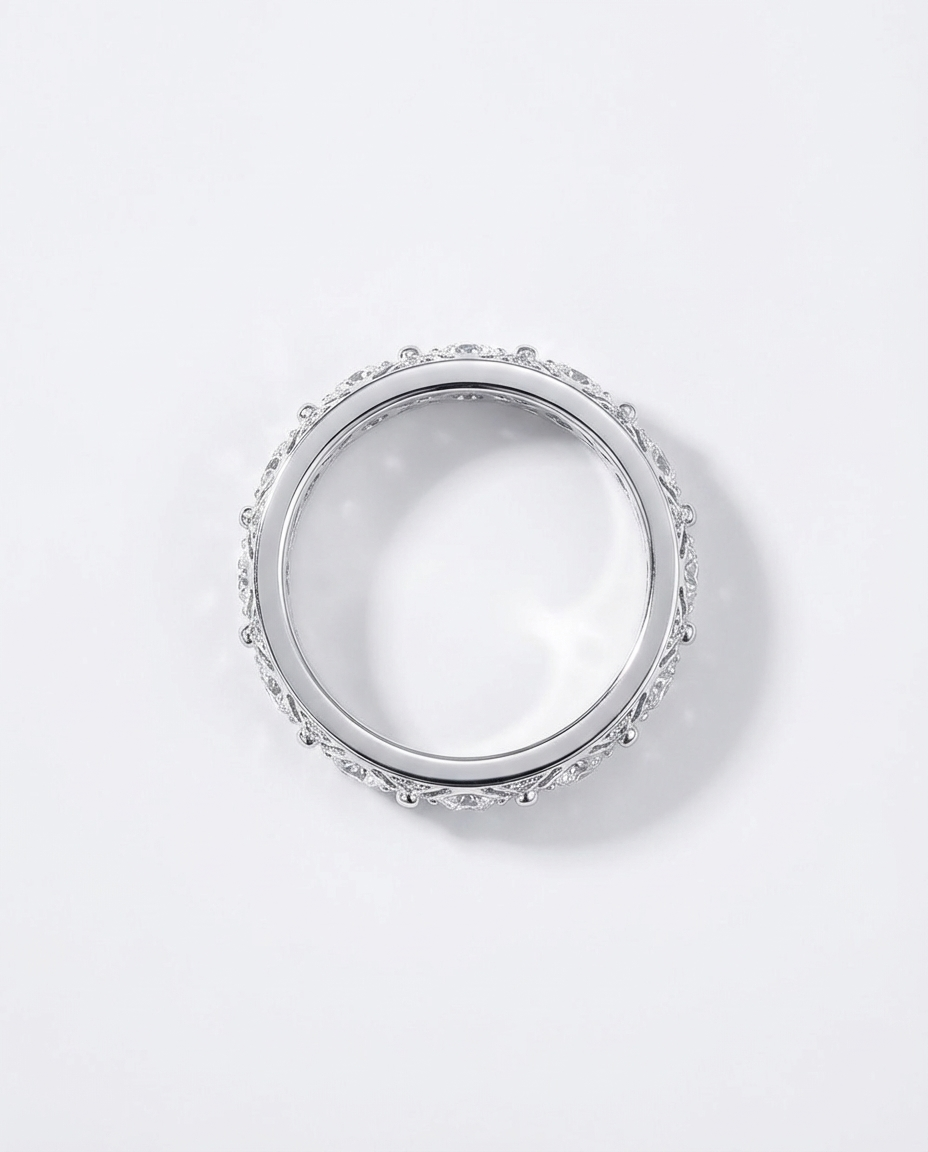 Silver ring with small stones on a white background