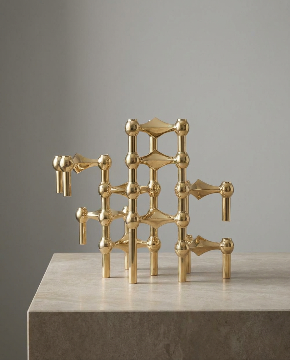 Gold geometric sculpture on a neutral background