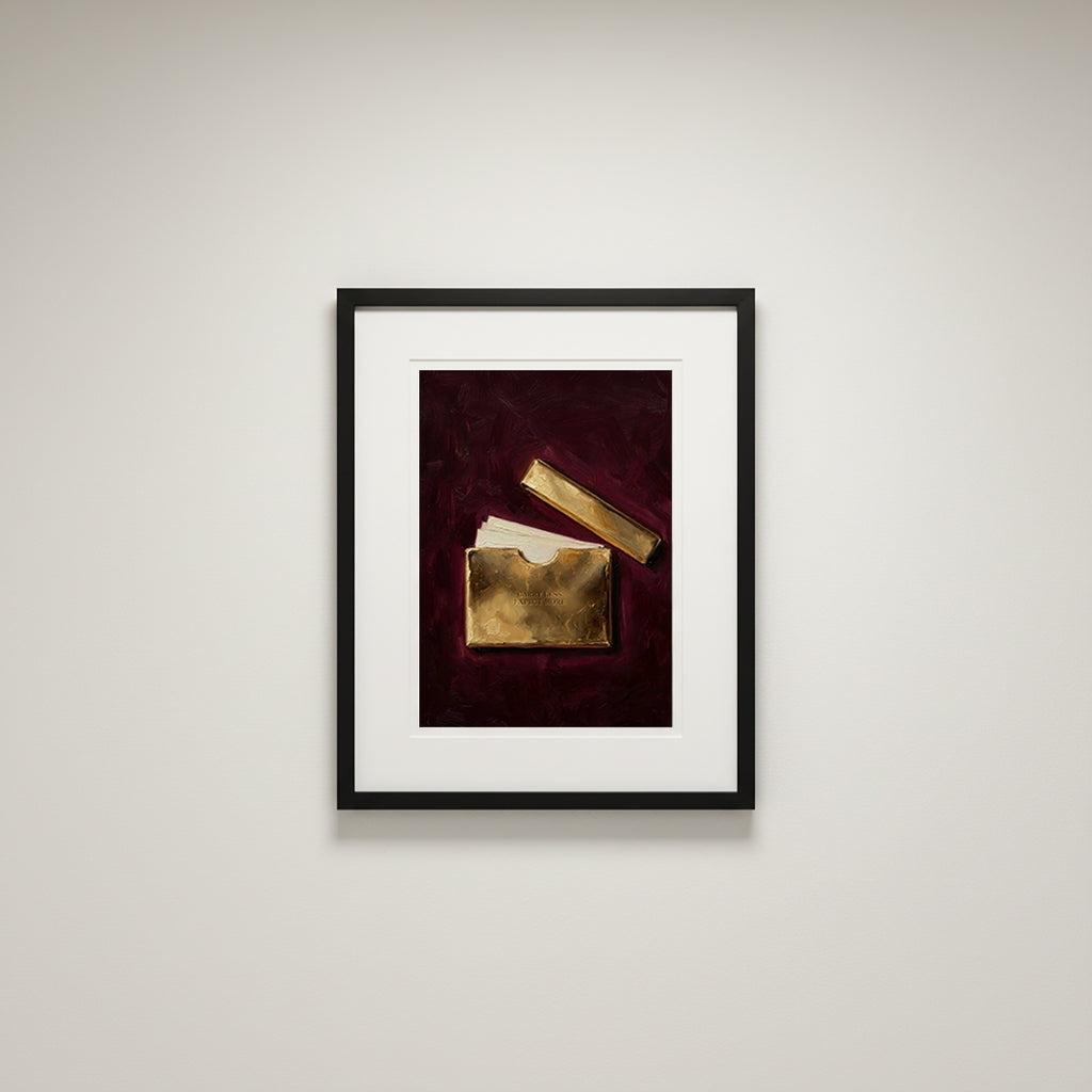 Framed artwork of gold objects on a red background