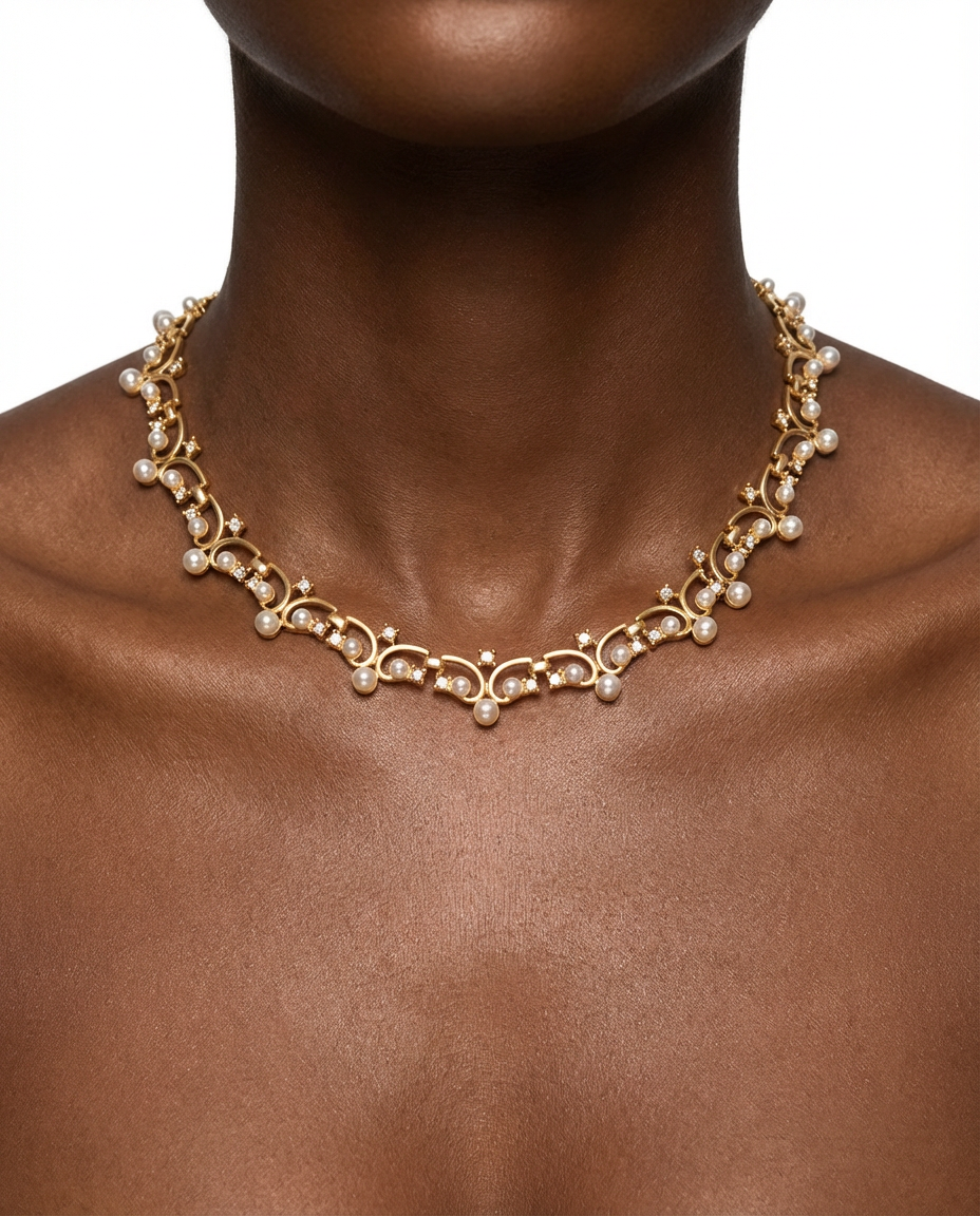 Gold necklace with pearls on a mannequin with a neutral background