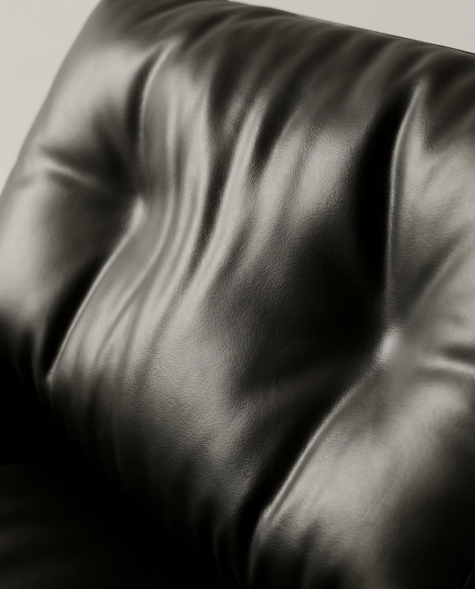 Close-up of a black leather surface with visible texture