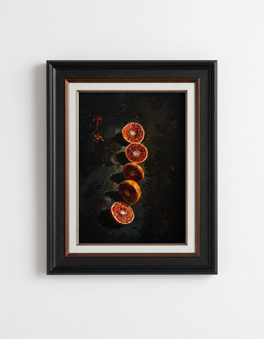 Framed artwork of sliced oranges on a dark background