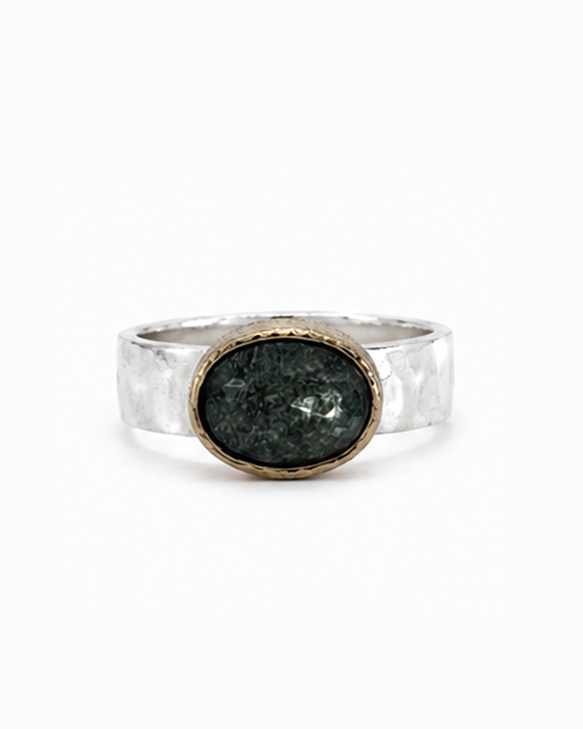 Oval green gemstone signet ring featuring a polished sterling silver band and softly brushed gold bezel. The dark moss green faceted stone sits in a minimalist contemporary setting, photographed against a clean white background.