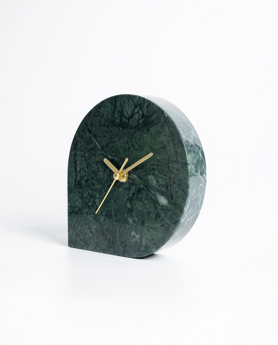 Green marble clock with gold hands on a white background