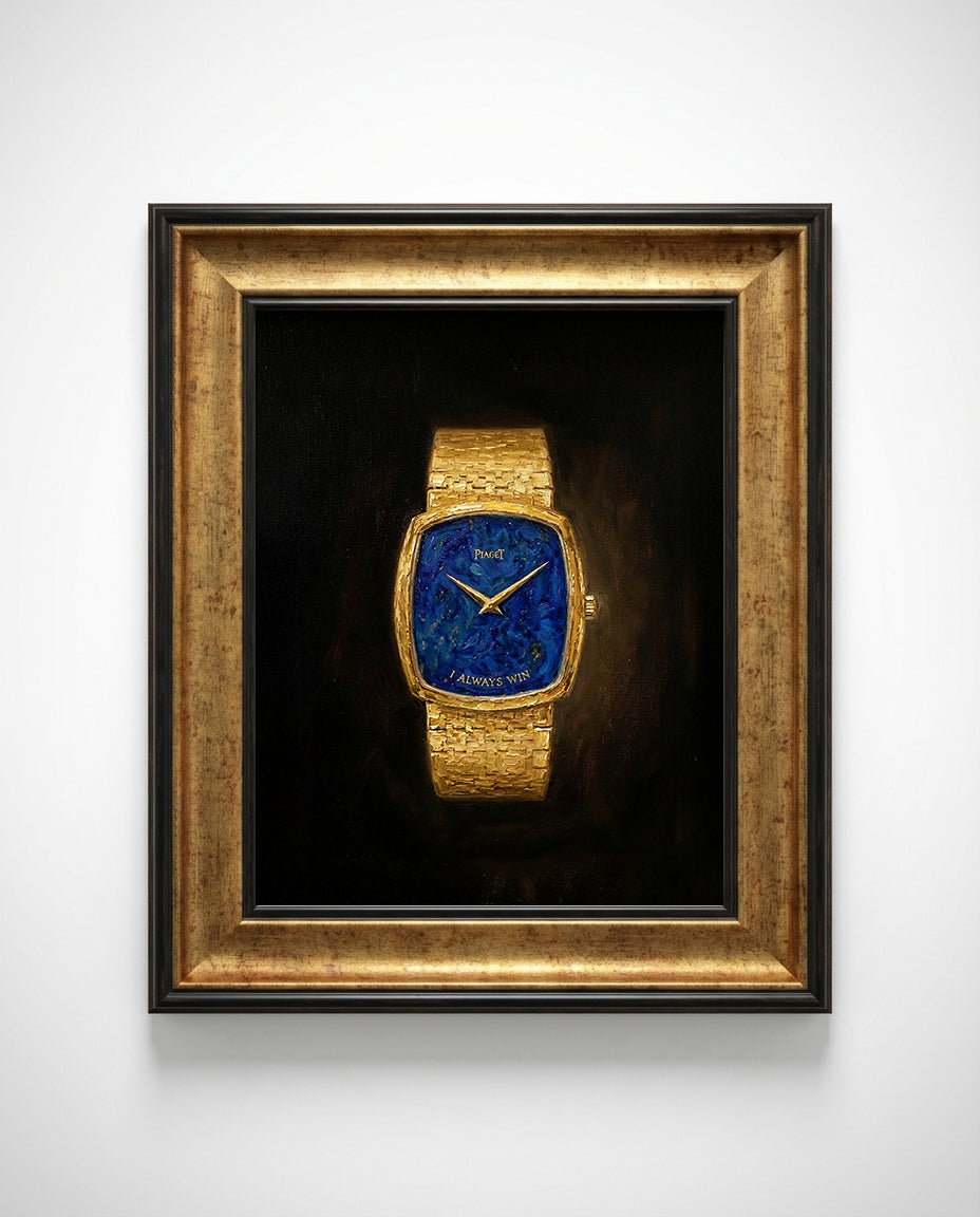 Gold watch with blue face in a bronze frame on a white wall