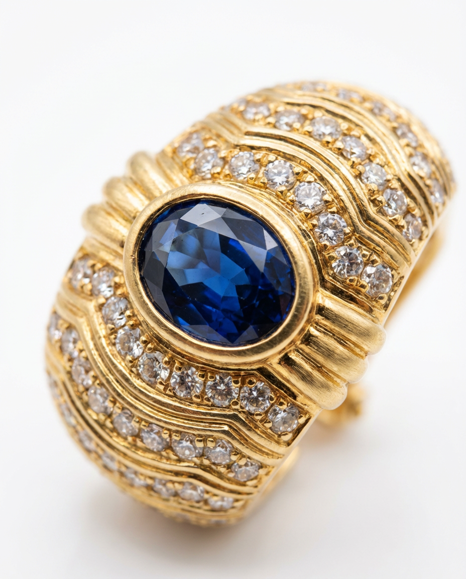 Gold ring with a blue gemstone and diamond accents on a white background