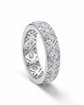 Silver ring with intricate design and embedded diamonds on a white background