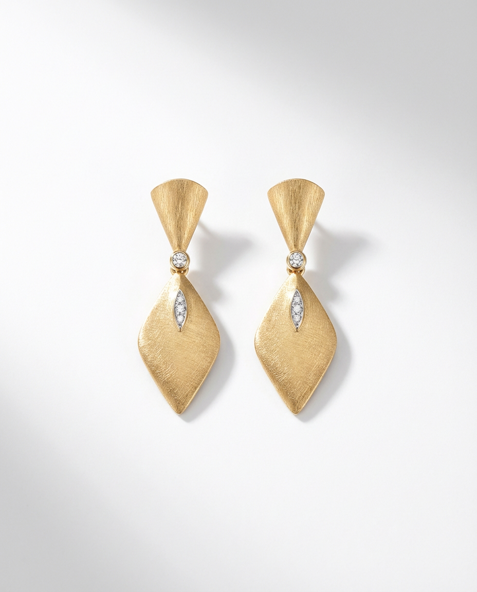 Pair of gold earrings with diamond accents on a white background