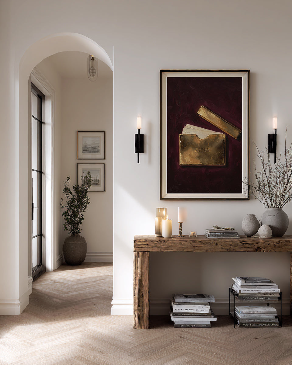Modern interior with a wooden console table, framed artwork, and decorative items.