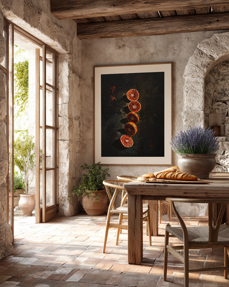 Dining room with rustic decor, including a framed artwork of sliced oranges and a table with bread.