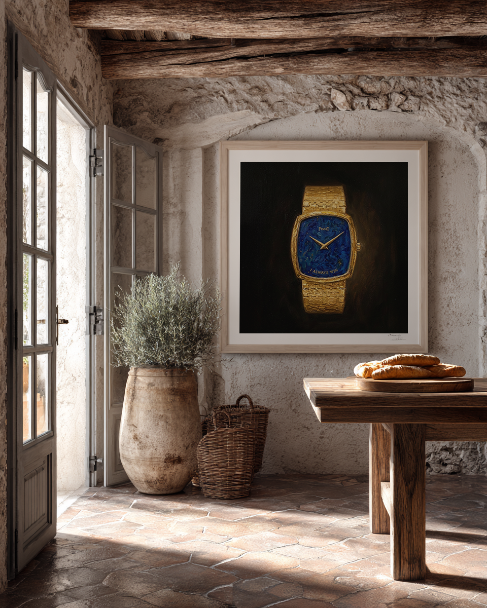 Framed picture of a gold watch with a blue face on a stone wall in a rustic room.