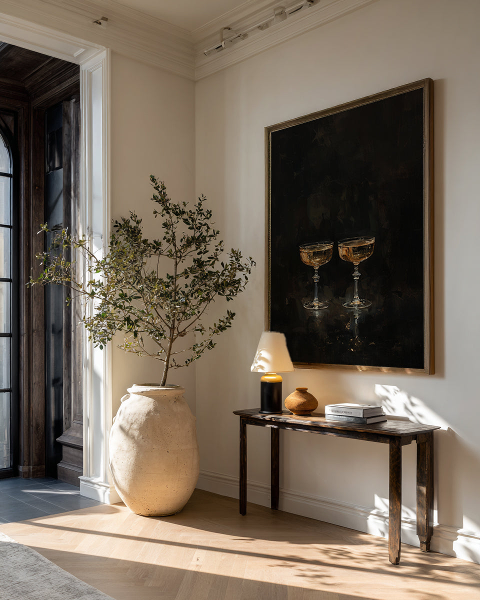 Modern interior with a vase, plant, and wall art in a home setting