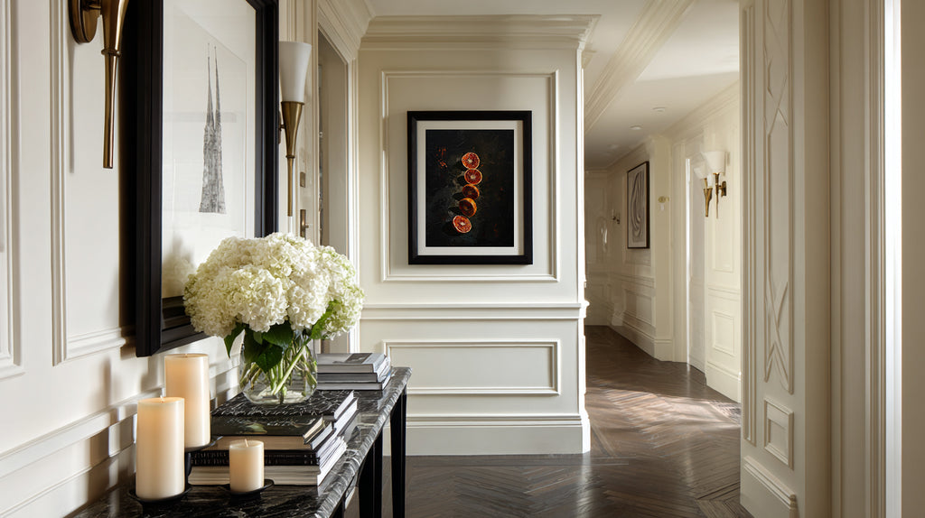 Elegant hallway with decorative elements including a mirror, candles, and artwork.