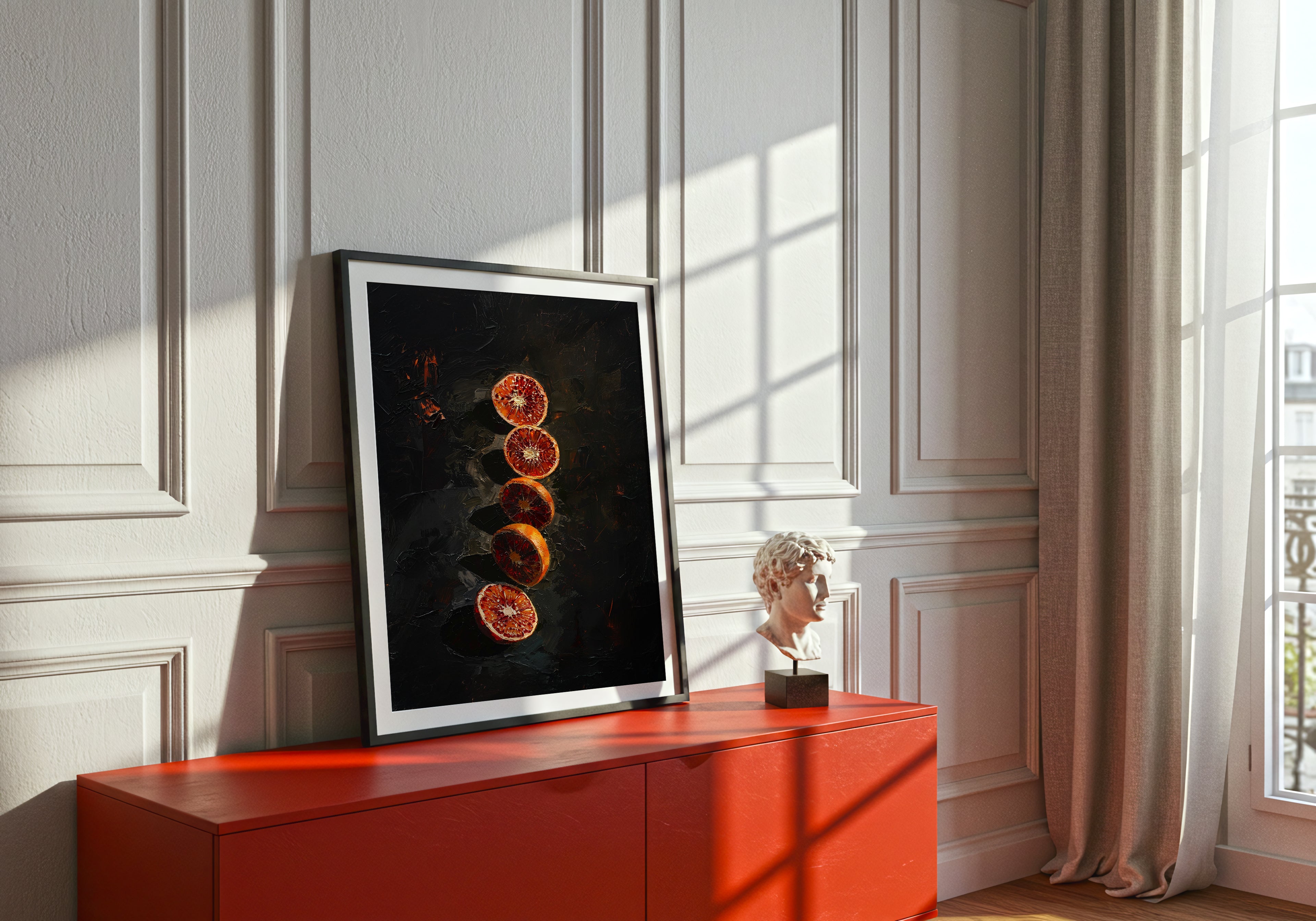Framed artwork on a red cabinet against a white paneled wall with sunlight streaming through curtains.
