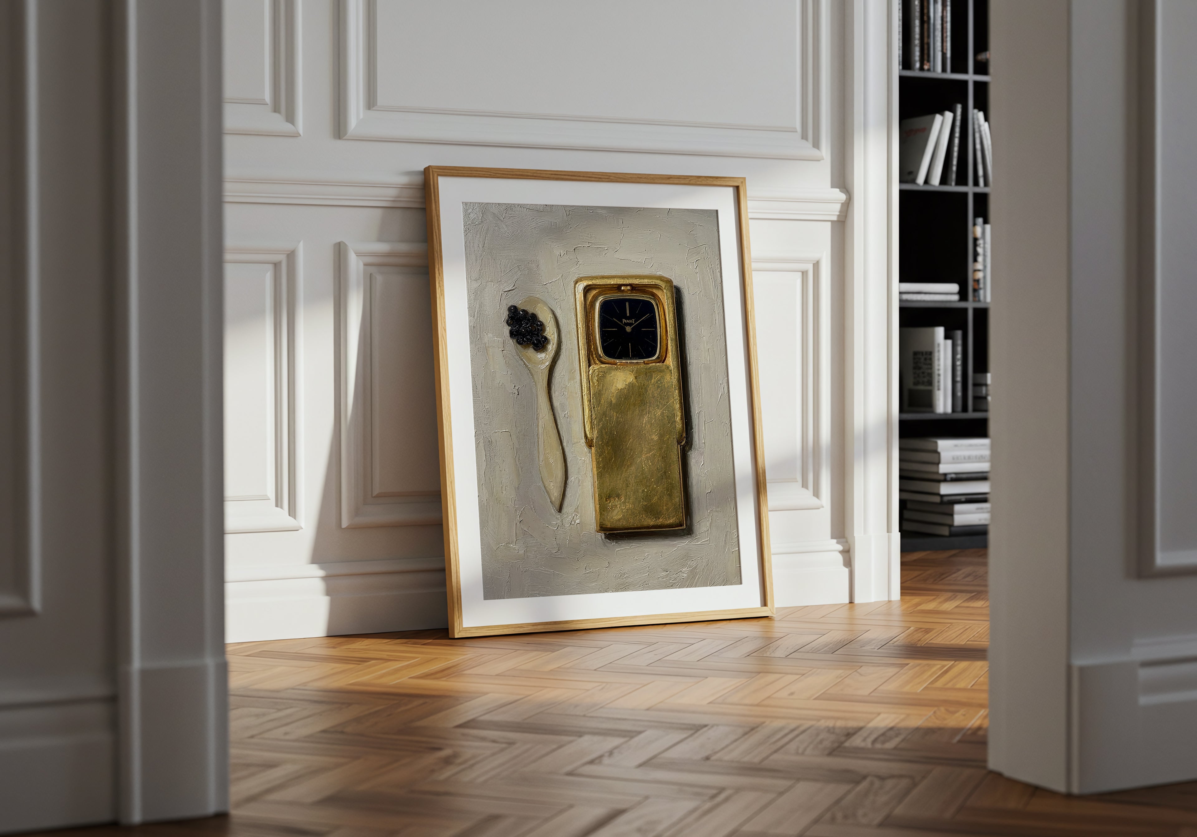 Framed artwork on a wall with a gold phone and black object
