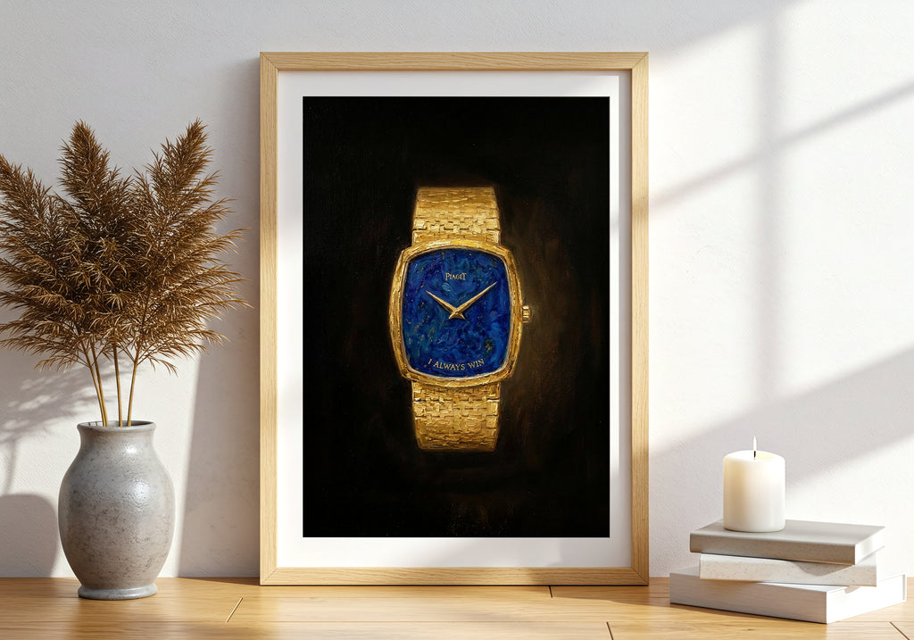 Framed picture of a gold watch with a blue face on a wall in a room with a plant and candle.